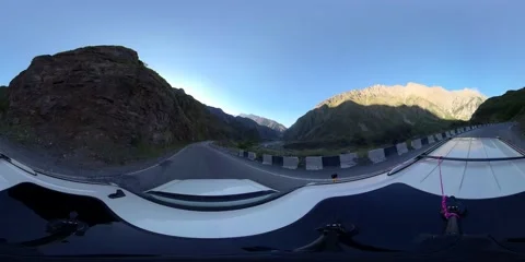 360 VR The car moves on the road against the background of mountains Stock Footage 167340489