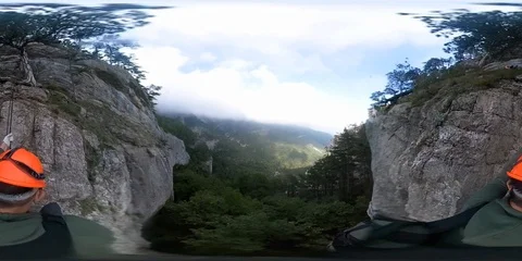 360 Vr climber lowing down by his belayer Wall Cave in the mountains Stock Footage 99935639