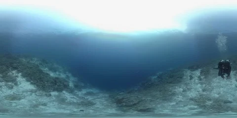360 vr diver swims on the edge of a coral reef Stock Footage 102395655