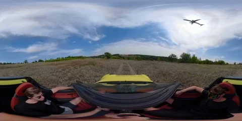 360 VR Driving on a cabriolet with Flying  airplane taking off a Sunny Day Stock Footage