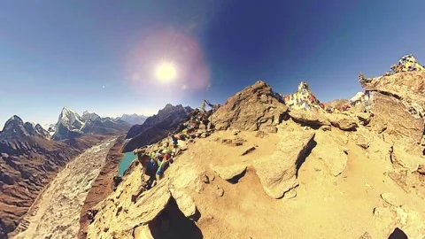 360 VR Gokyo Ri mountain top. Tibetan prayer Buddhist flag. Wild Himalayas high Stock Footage 156802176