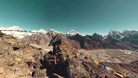 360 VR Gokyo Ri mountain top. Tibetan prayer Buddhist flag. Wild Himalayas high Stock Footage 165577065