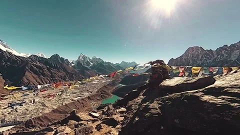 360 VR Gokyo Ri mountain top. Tibetan prayer Buddhist flag. Wild Himalayas high Stock Footage 165577161