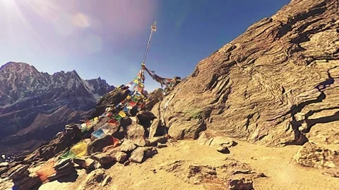 360 VR Gokyo Ri mountain top. Tibetan prayer Buddhist flag. Wild Himalayas high Stock Footage 165577337