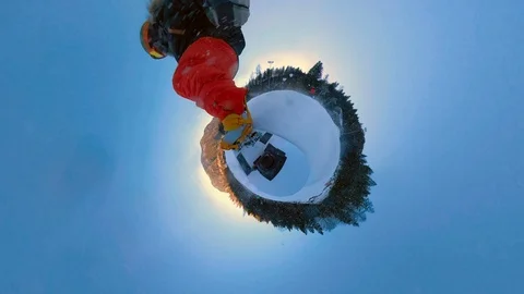 360 VR Spherical video of a snowboarder riding the little snowy planet Stock Footage 100664645