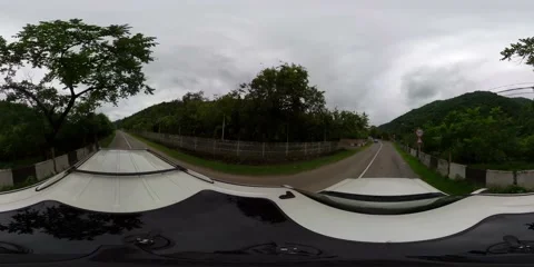 360 vr SUV rides a highway on a cloudy day Stock Footage 167282737