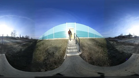 360 VR View at Man Entering Highway Via Noise Barrier Stock Footage 121270186