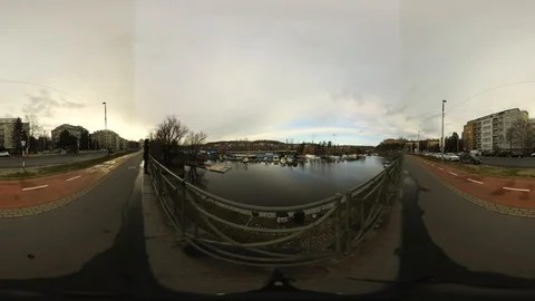 360 VR view at Vltava River and Fishermen sitting on its Quay in Prague Stock Footage 121357035