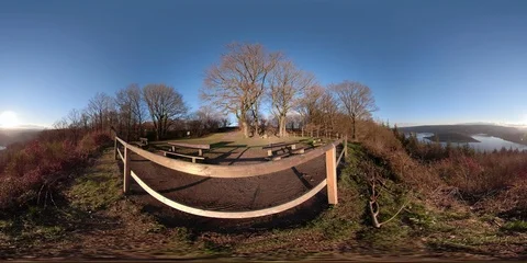 360 VR Viewpoint in forest with vista over lake at sunset Stock Footage 101231916