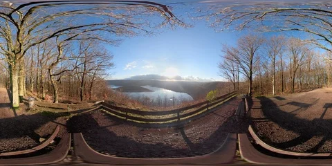 360 VR Viewpoint in forest with vista over lake at sunset Stock Footage 101236553