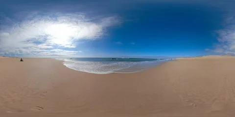 360 VR Young man sitting on empty beach 動画素材 96848437