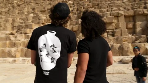 360 Wrap of 2 Men Admiring the Giza Pyramid Stock Footage 146051025