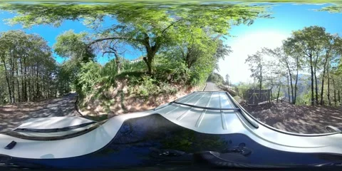 360VR car driving on a narrow mountain road Stock Footage 167774009