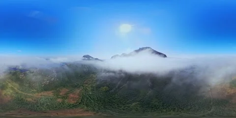 360VR Mountain Peak Rising Above Sea of Clouds Stock Footage 340237445