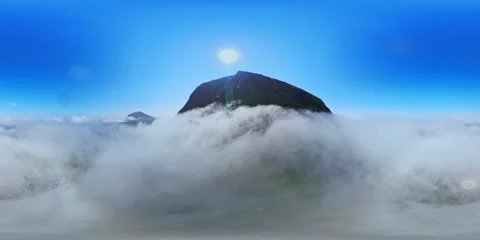 360VR Mountain Summit Emerging from a Sea of Clouds Stock Footage 340237347