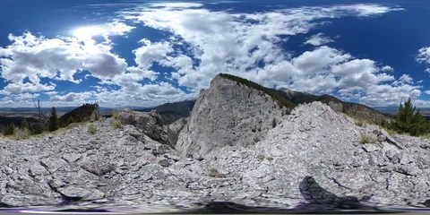 360VR Pale grey-white Cliffs under fast moving Clouds and Blue Sky Stock Footage 91301560