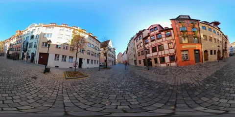 360VR People walking down cobbled street in old Nuremberg, historical city Stock Footage 104276500