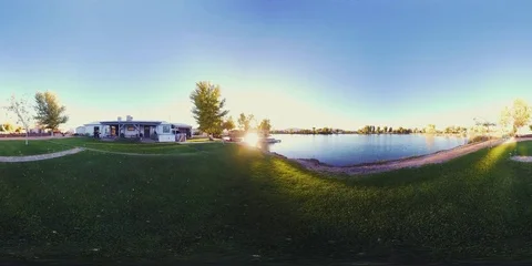360VR Sunset time lapse on private lake, kids playing, night lights turning, 8K Vidéo 81715467