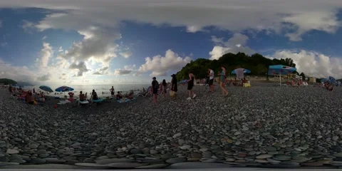 360VR tourists on a pebble beach Stock Footage 167789008