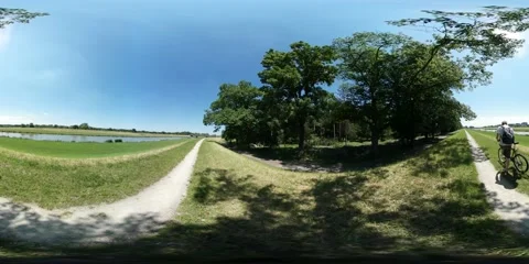 360Vr Video Backpacker is Riding by the Road on Field Spherical Panorama Man on Stock Footage 64085757