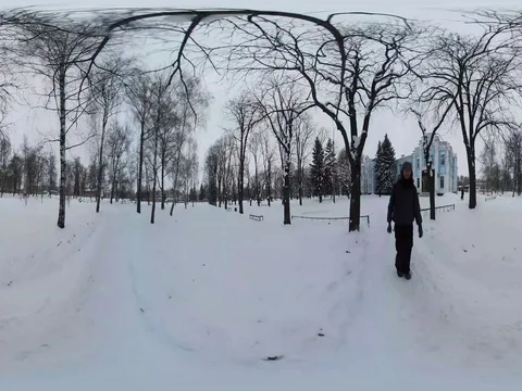 360Vr Video Blue Building in Small Town Wintry Snowy Park Man is Walking at the Stock Footage