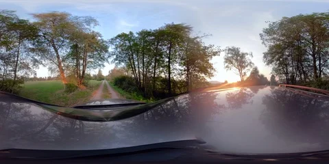 360VR Video. Driving car on a country road at sunset Stock Footage 94123853