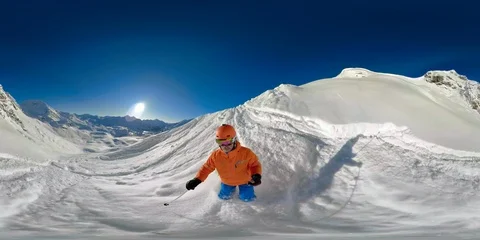 360VR video man skiing in deep snow and on ski piste Stock Footage 86255939