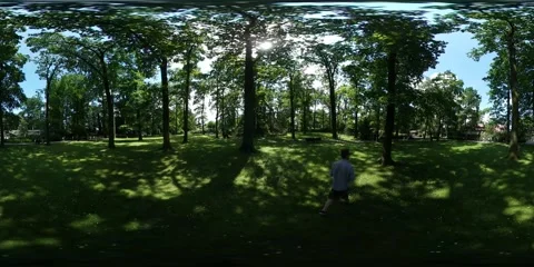 360Vr Video Man Walking by Grass in Park Trees Green Lawn Forest in Sunny Stock Footage 64083275