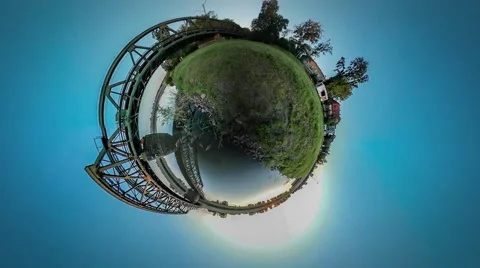 360Vr Video Train is Riding Over River by Bridge Houses Village on a Bank Metal Stock Footage 64557815