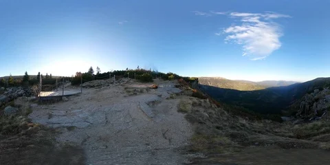 360VR video of a view on a forested, hilly area from a cliff on a sunny day Stock Footage 109628655