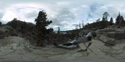 360VR waterfall overlooking lake on cloudy day 3840x1920 45 seconds Stock Footage 109498542