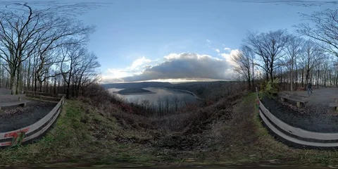 360VR Young man watching over lake landscape on viewpoint in the forest Stock Footage 101225063