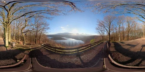 360VR Young man watching over lake landscape on viewpoint in the forest Stock Footage 101238393