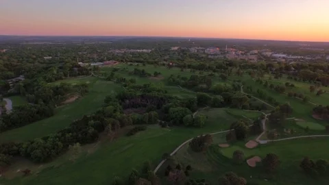 3.61 Manhattan Golf Course Slow Pan to Reveal Low Sunset 001710 Stock Footage 90258531