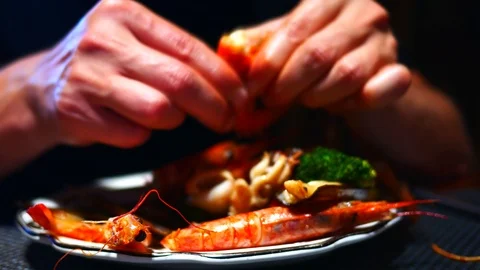362Man hands close up while pilling and eating grilled shrimps with asparagus Stock Footage 88696076