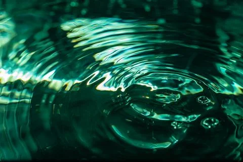 369.Abstract close-up of water drop collision. Stock Photos