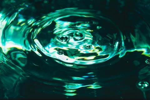 372.Concentric Ripples and Bubbles on Blue-Green Water Stock Photos