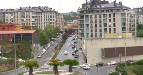 382 Traffic going around roundabout into downtown Ourense, Spain Stock Footage 132459119