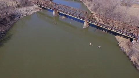3.97 4K Moving Upstream Passing Over Railway Bridge 001106 Stock Footage 90258936