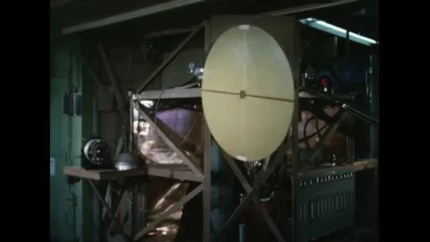 A-3A sitting in FG with a Phoenix Missile aboard, technicians installing Phoenix Stock Footage 116044484