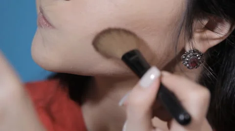 3applying blush on cheekbones Stock Footage 62407565
