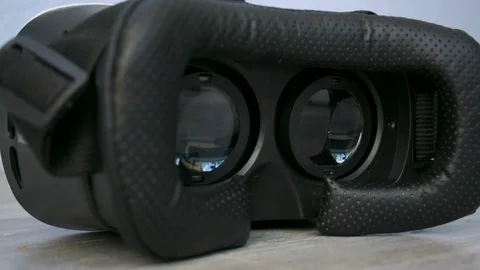 3D 360 VR virtual reality glasses laying on the floor working, playing a game 스톡 동영상 93643355