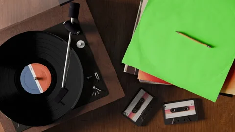 3D animation featuring a retro vinyl record player on a wooden table Stock Footage 317617733