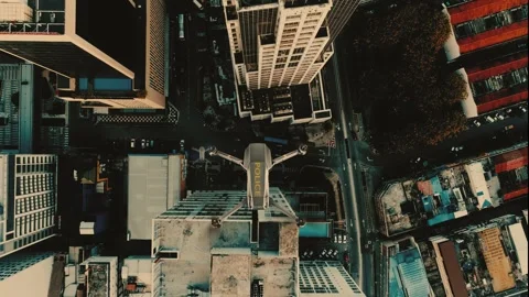 3D Animation. Police Drones Multi-rotor flying above the city at sunset scene to Stock Footage 247837175