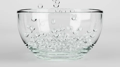 3D Animation Rendering of Glass Marbles falling into a Glass Bowl 4K Stock Footage