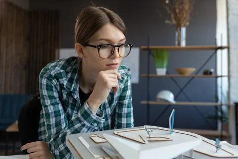 3d architect working in office with building 3D model. Engineer inspect building Stock Photos