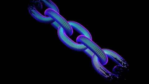 3D chain links is gradually created from pixels on black background. A Stock Footage 253884486