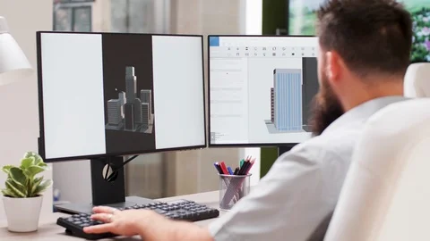 In 3D design office bearded architect works on new building prototype Stock Footage 110473915