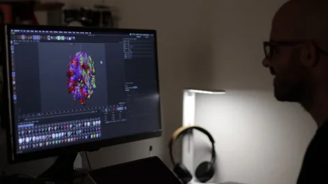 3D designer works on a 3d model. Animated graphics rendering Stock Footage 135985901