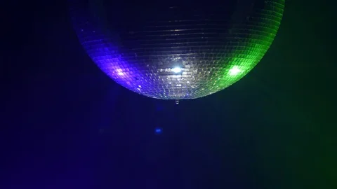 3D Disco mirror ball reflecting colorful lights in smoke Stock Footage 93899671